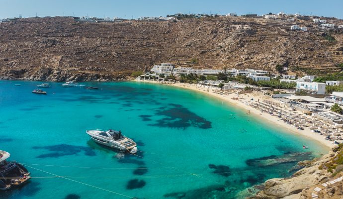 Aerial,Panoramic,View,Of,The,Famous,Psarou,Bay,With,Iconic